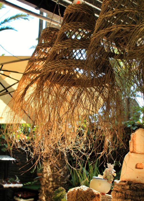 Raffia lamps for sale hanging in a shop in Elche, Spain